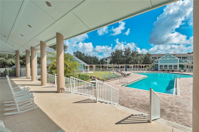 view of pool featuring a patio