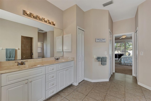 bathroom featuring tile floors, ceiling fan, and double sink vanity