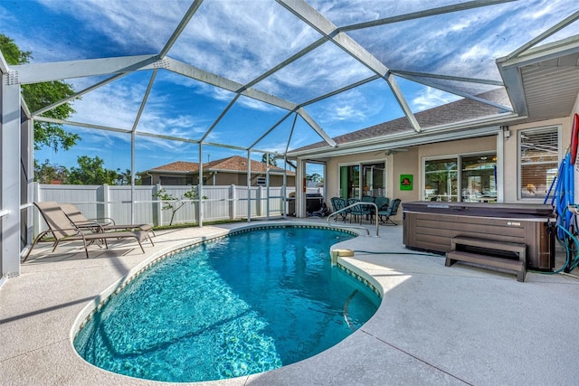 view of pool featuring a hot tub, a lanai, and a patio