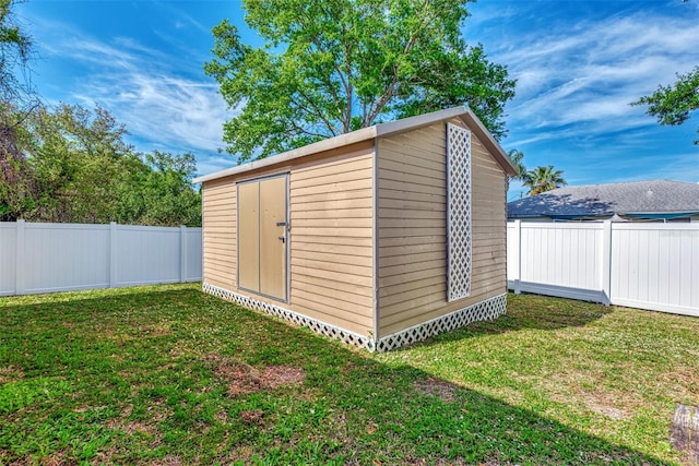 view of shed / structure featuring a yard