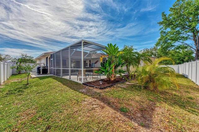 view of yard featuring a patio and a lanai