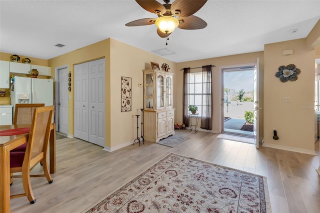 foyer featuring light hardwood / wood-style floors and ceiling fan