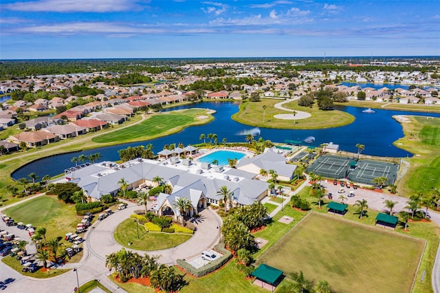 birds eye view of property with a water view