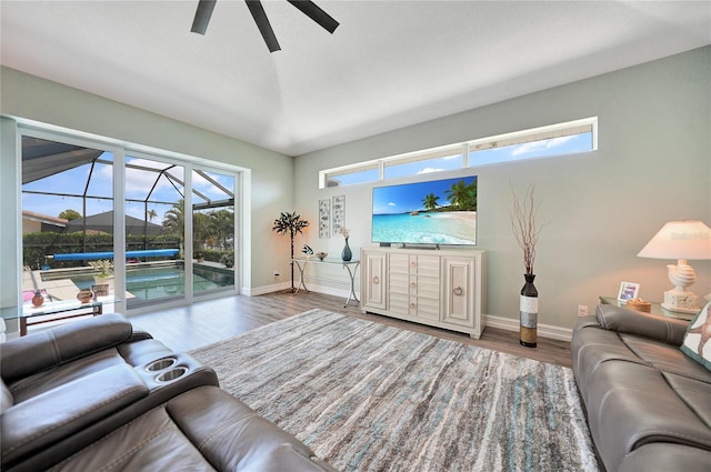 living room with light hardwood / wood-style floors and ceiling fan