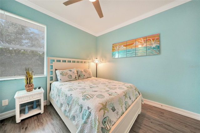 bedroom with ornamental molding, dark hardwood / wood-style flooring, and ceiling fan