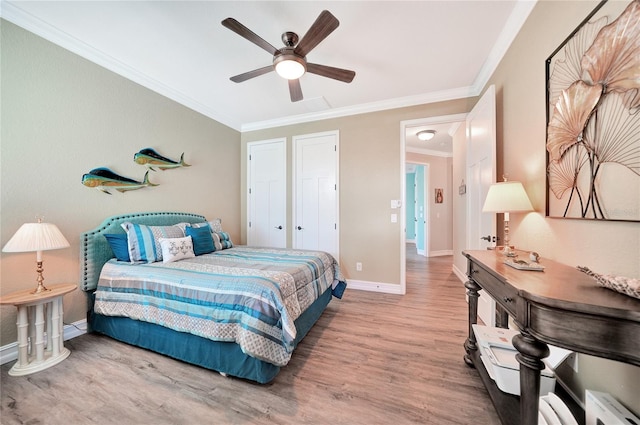 bedroom featuring ceiling fan, ornamental molding, and light hardwood / wood-style flooring