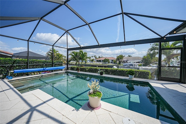 view of pool featuring a patio area and a lanai