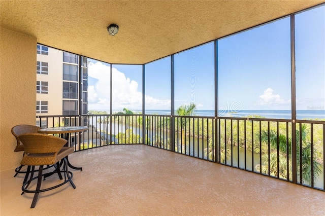 sunroom with a water view