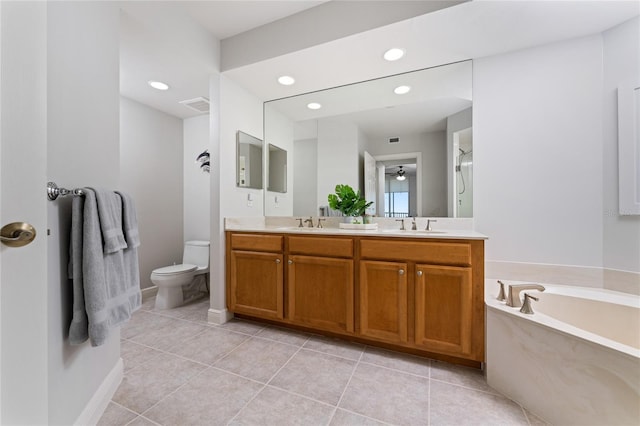 bathroom with a bath, tile patterned floors, vanity, and toilet