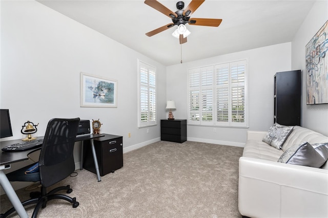 office area featuring ceiling fan and light colored carpet