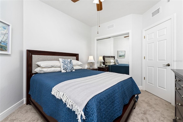 bedroom featuring light carpet, a closet, and ceiling fan