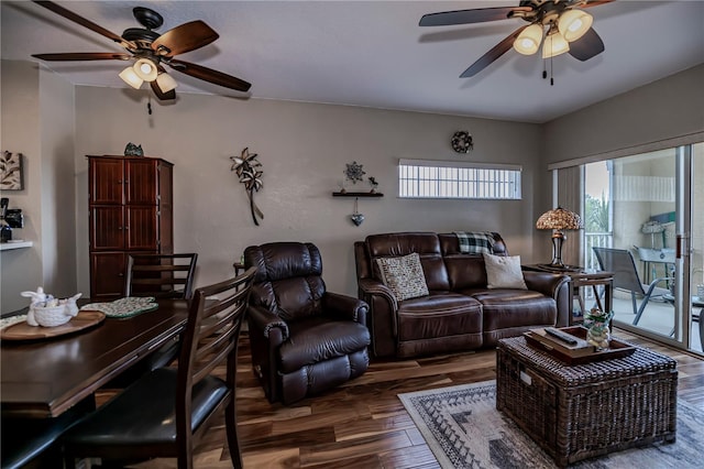 living room featuring dark hardwood / wood-style floors and ceiling fan