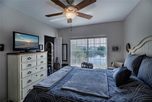 bedroom featuring ceiling fan and access to exterior