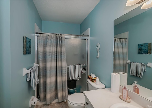 bathroom featuring toilet and large vanity