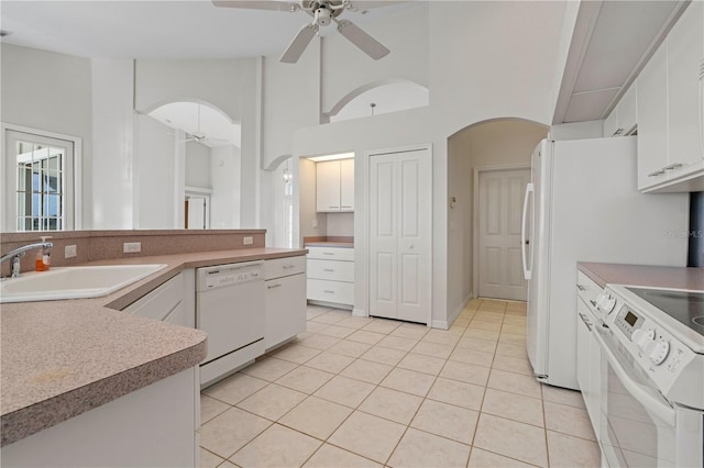 kitchen featuring white cabinets, ceiling fan, white appliances, and sink