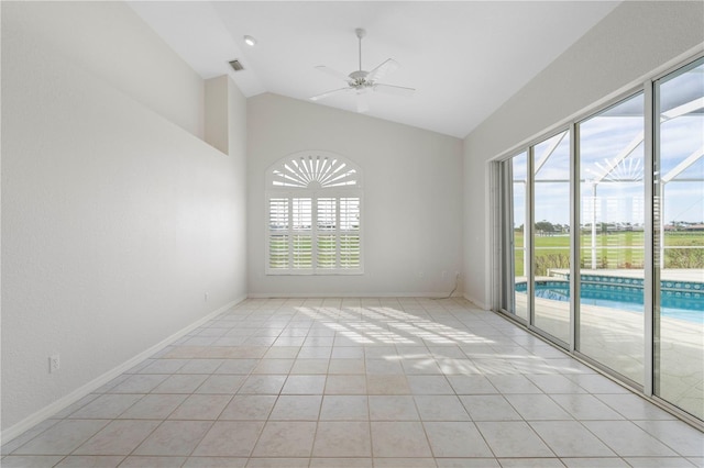 tiled spare room with ceiling fan and lofted ceiling