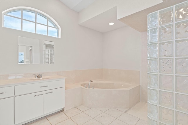 bathroom featuring vanity, tile patterned floors, and a bathtub