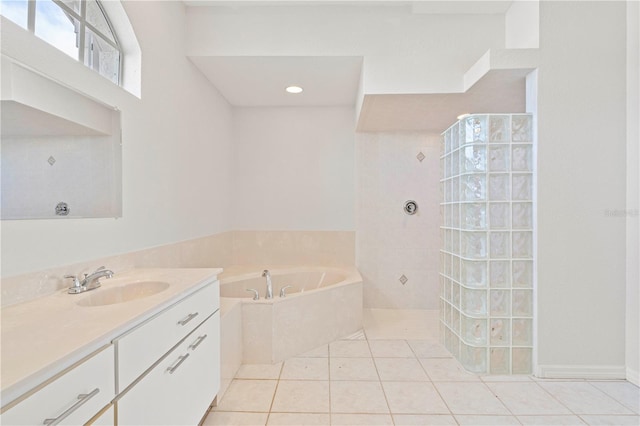 bathroom featuring tile patterned flooring, vanity, and shower with separate bathtub