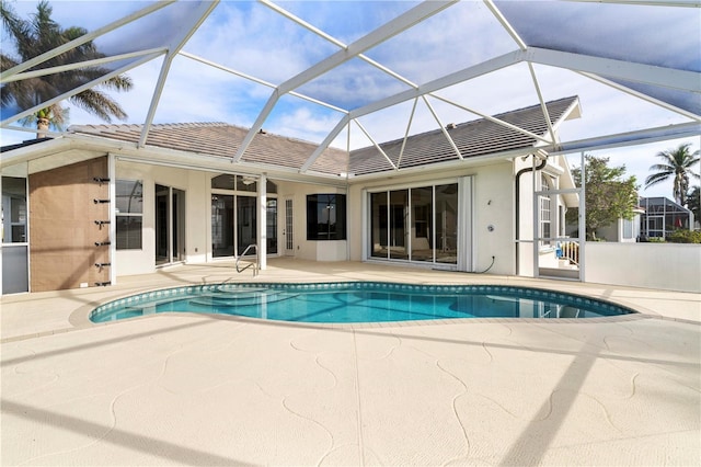 view of pool featuring a lanai and a patio