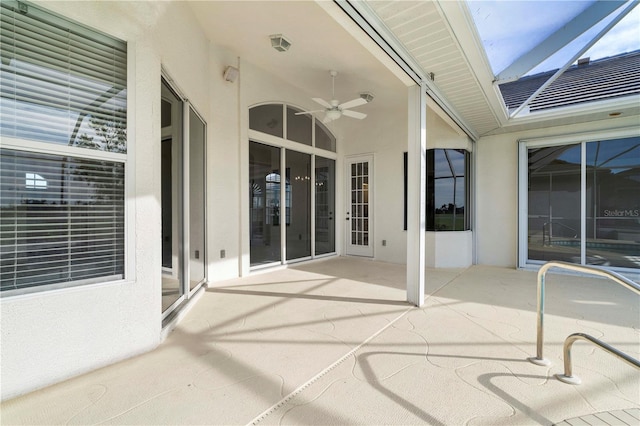 view of patio / terrace with glass enclosure and ceiling fan