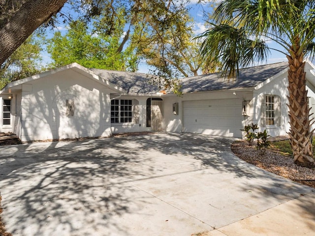 ranch-style home featuring a garage