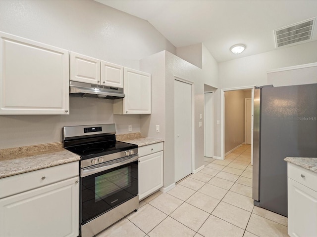 kitchen featuring light tile floors, appliances with stainless steel finishes, and white cabinetry