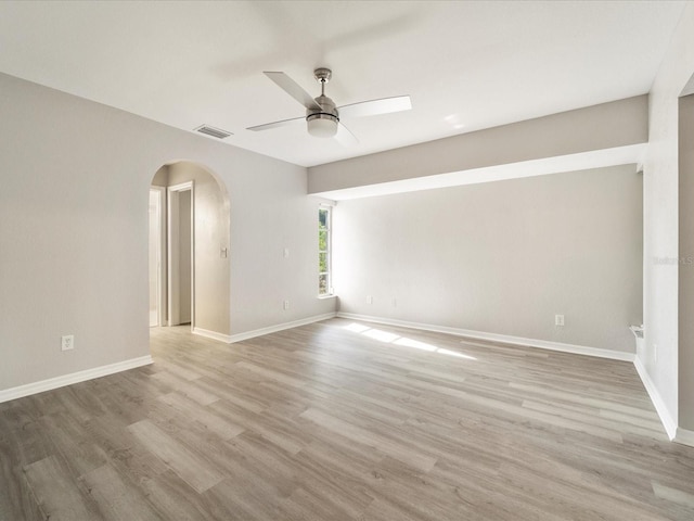 empty room featuring ceiling fan and light hardwood / wood-style flooring