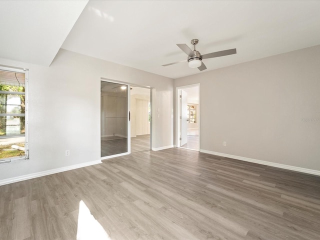 empty room featuring dark hardwood / wood-style floors and ceiling fan