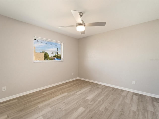 unfurnished room with ceiling fan and light wood-type flooring