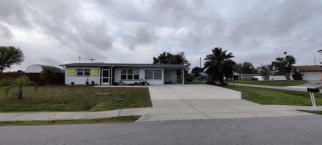 ranch-style house with a porch and a front lawn