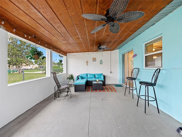 exterior space with outdoor lounge area and ceiling fan