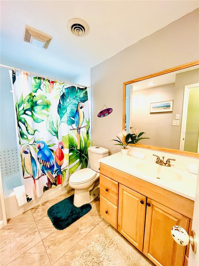 full bathroom with toilet, tile floors, vanity with extensive cabinet space, and shower / bath combo with shower curtain