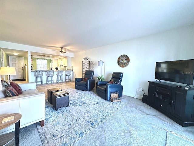 living room featuring ceiling fan