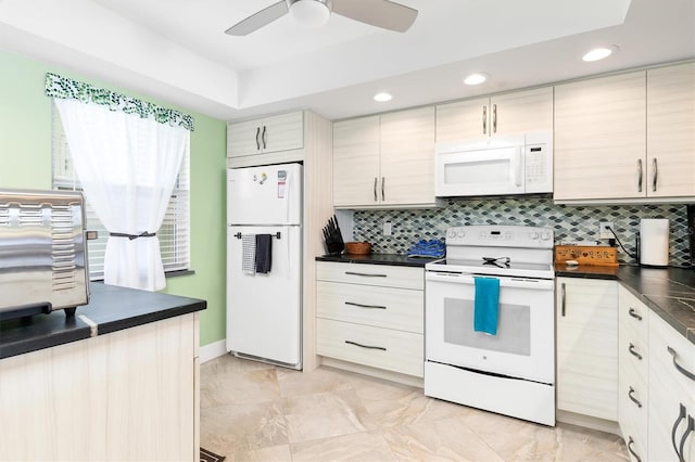 kitchen featuring white appliances, ceiling fan, and backsplash