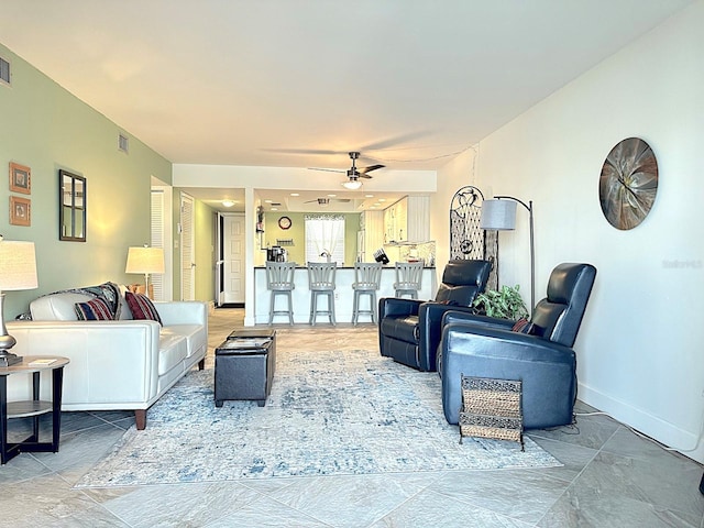 living room with ceiling fan