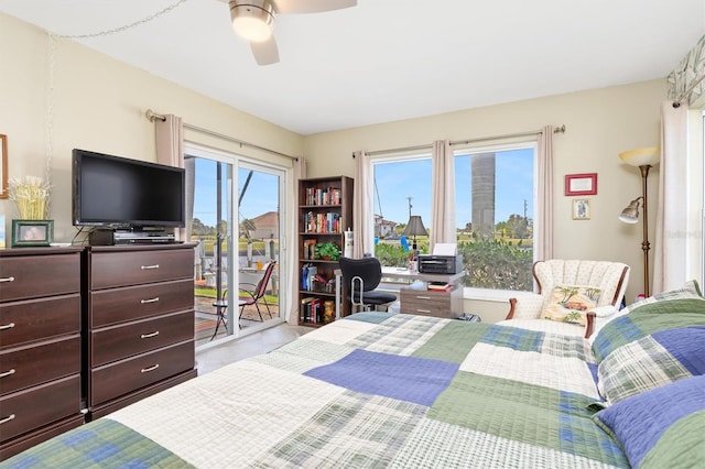 tiled bedroom featuring ceiling fan and access to exterior