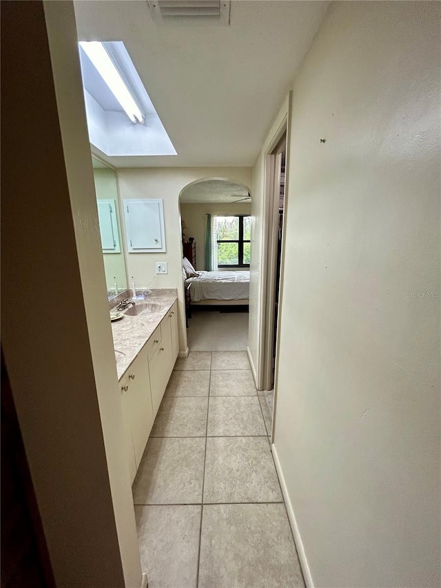 bathroom featuring tile patterned flooring and vanity