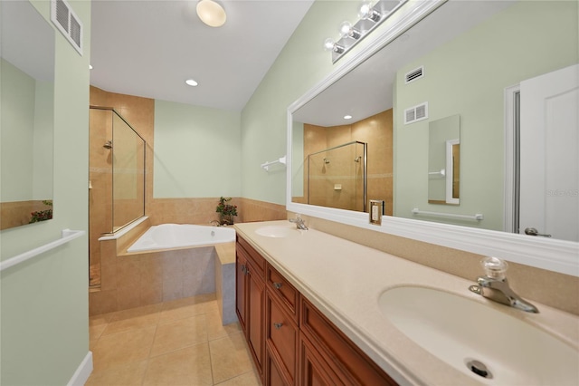 bathroom with separate shower and tub, tile floors, dual sinks, and large vanity