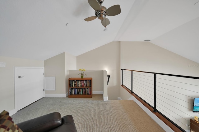 additional living space featuring light carpet, ceiling fan, and lofted ceiling