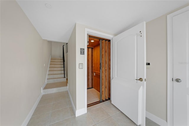 hallway with light tile floors