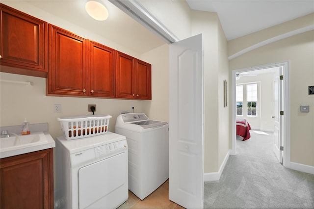 laundry room with electric dryer hookup, ceiling fan, cabinets, light carpet, and washing machine and dryer