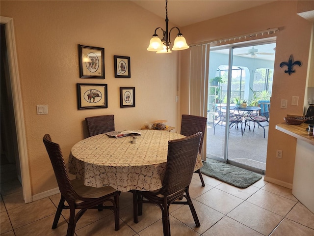 tiled dining space with an inviting chandelier