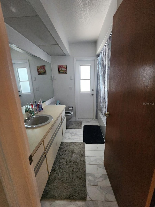 bathroom with tile floors, large vanity, and toilet