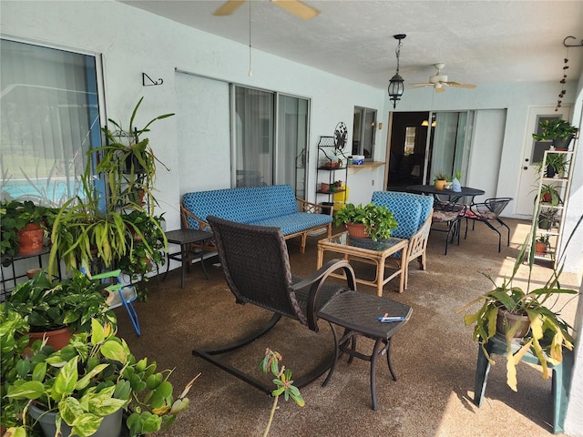 view of patio featuring ceiling fan