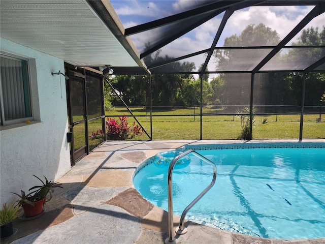 view of pool featuring a patio area, a lanai, and a yard