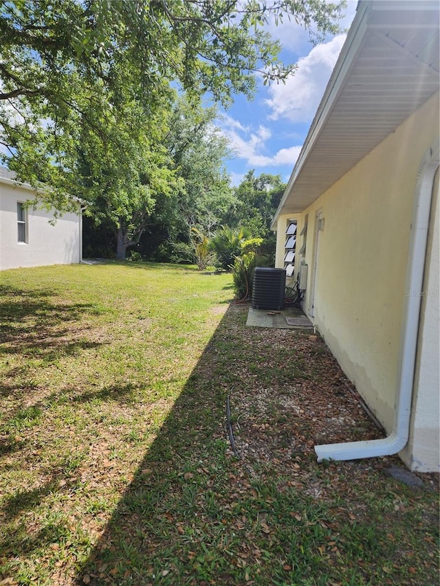 view of yard with central AC