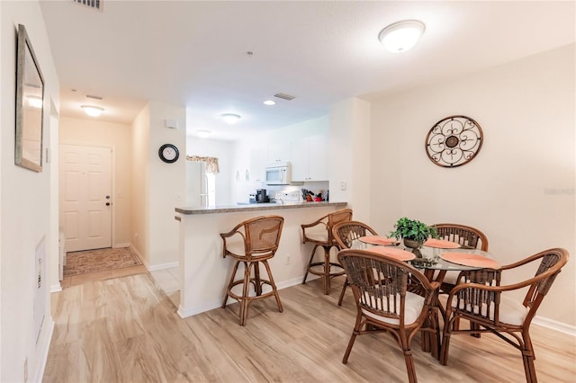 dining area featuring light hardwood / wood-style floors