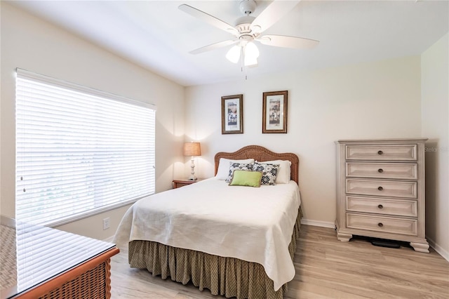 bedroom featuring ceiling fan and light wood-type flooring