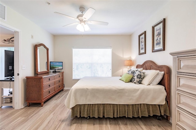 bedroom featuring light hardwood / wood-style flooring and ceiling fan