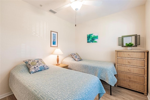 bedroom featuring ceiling fan and light wood-type flooring